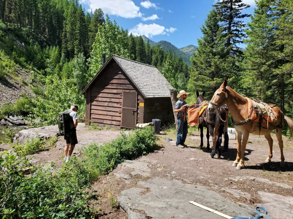 Snowy Springs Outfitters meet at Granite Cabin with River Ambassador gear and provisions.