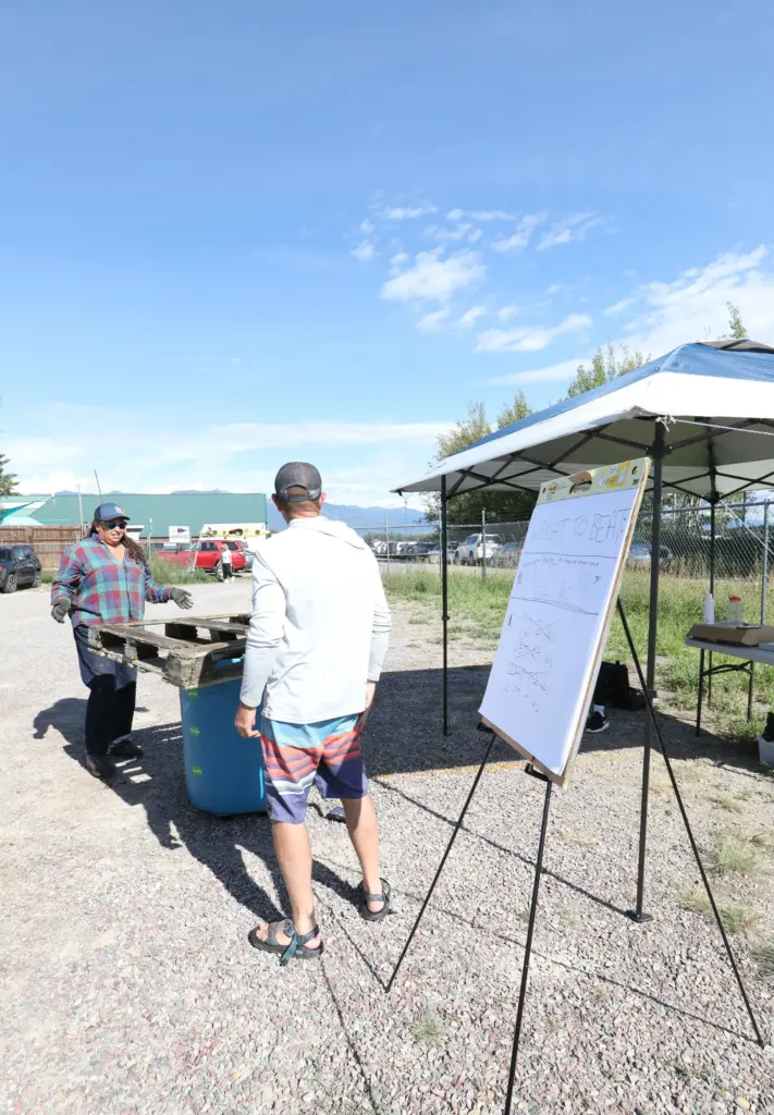 2025FlatheadWatersCleanup SacredWatersAfterparty Weigh inStation Heidi WesternMontanaConersvationCommissionwithparticipant SheenaPate