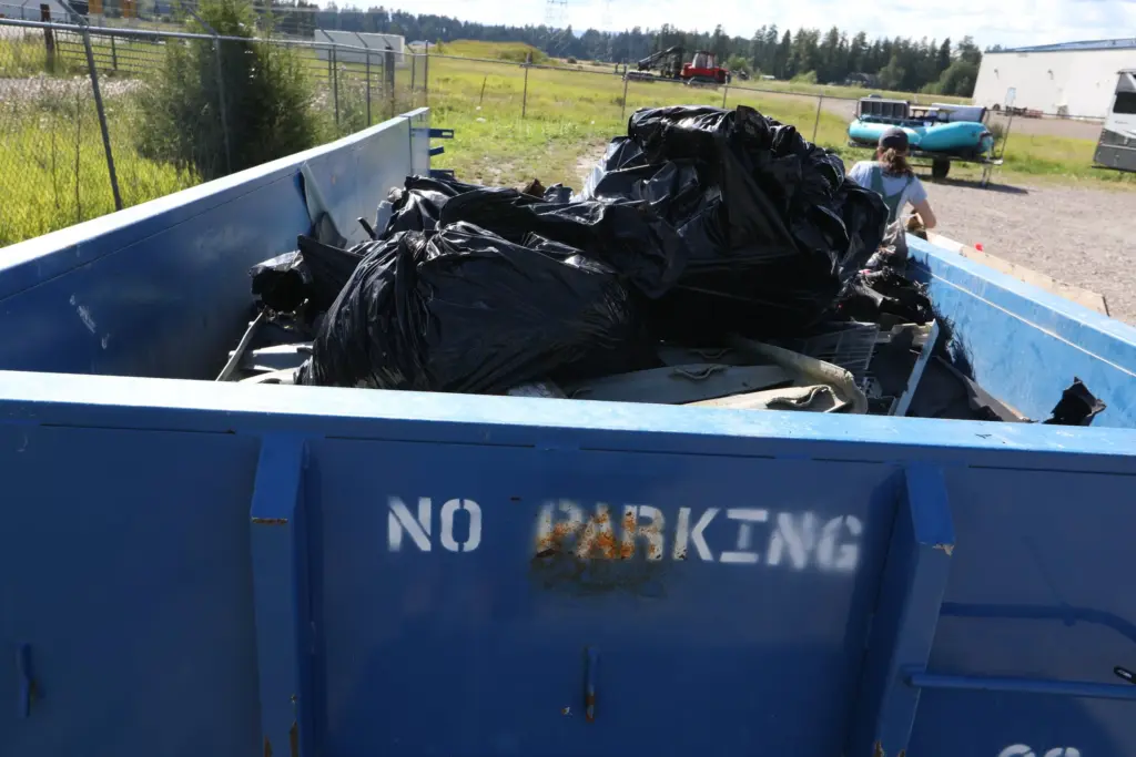 2025FlatheadWatersCleanup SacredWatersAfterparty Weigh inStation Samantha FlatheadConservationDistrict RecyceandTrashSorting SheenaPate